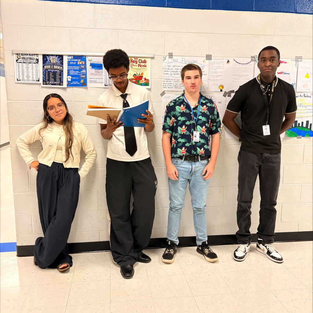 four students dressed as teachers