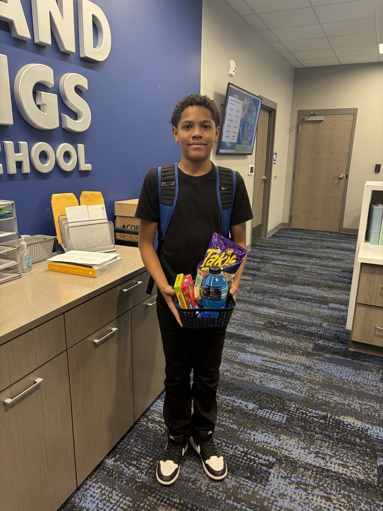 Student posing with gift basket
