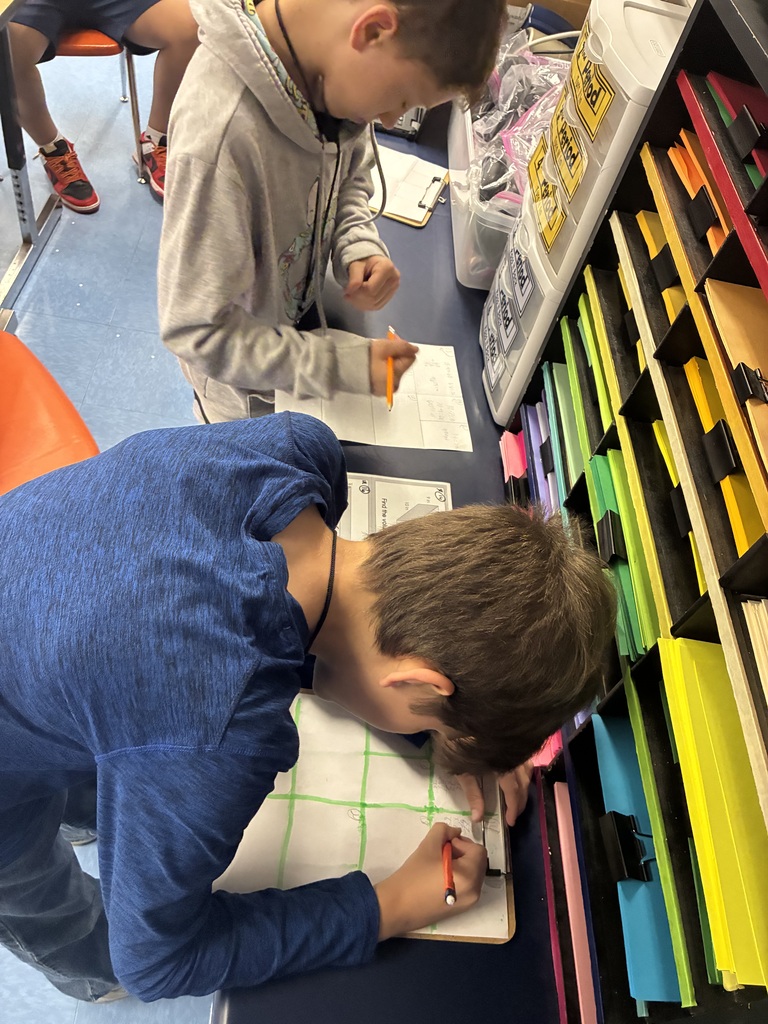 Students find surface area and volume.