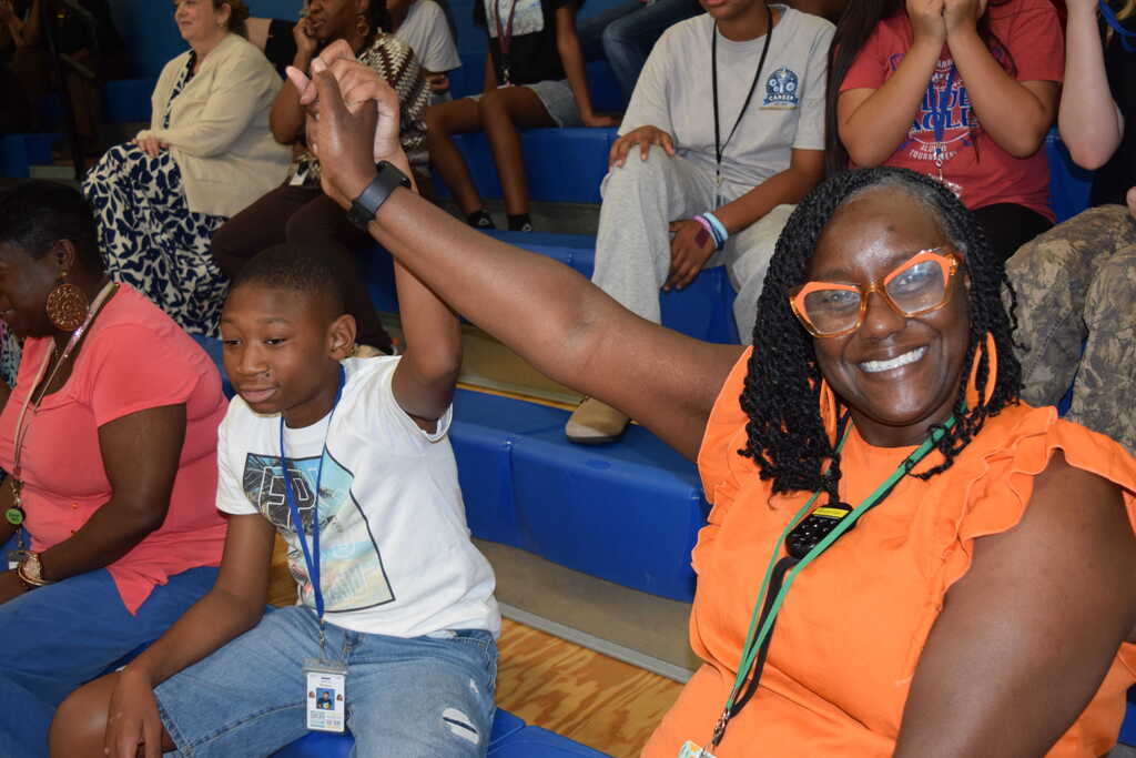 Student and teacher at incentive assembly