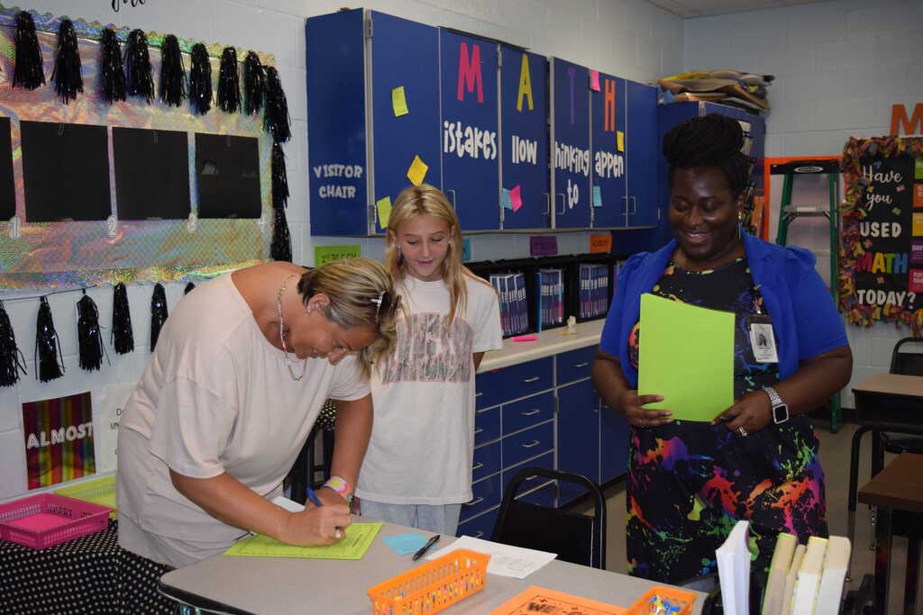 Parent, student, and teacher at Open House