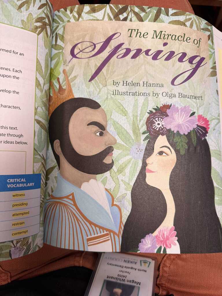 An open book titled "The Miracle of Spring" by Helen Hanna, featuring a man and woman with flower crowns.