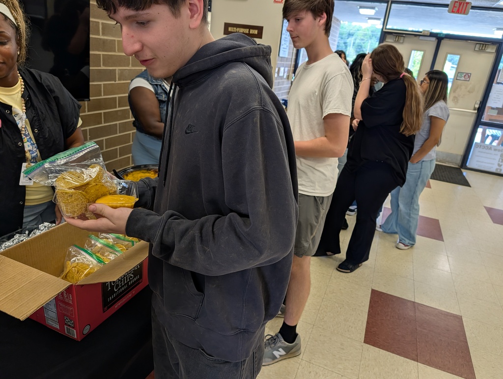 students buy nachos for a fundraiser