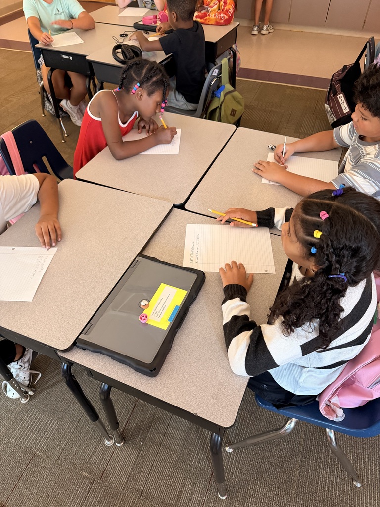  Six students are writing at their desks.