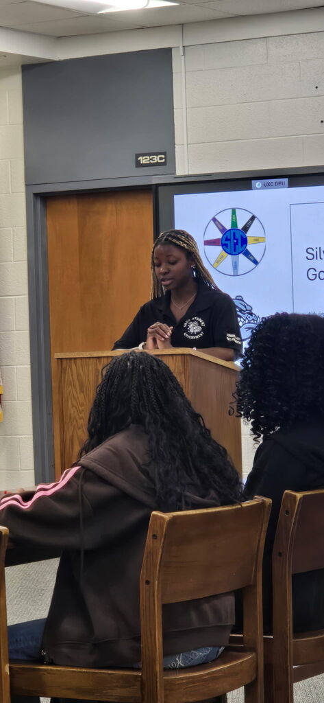 Student Body President Candace Williams speaking to students