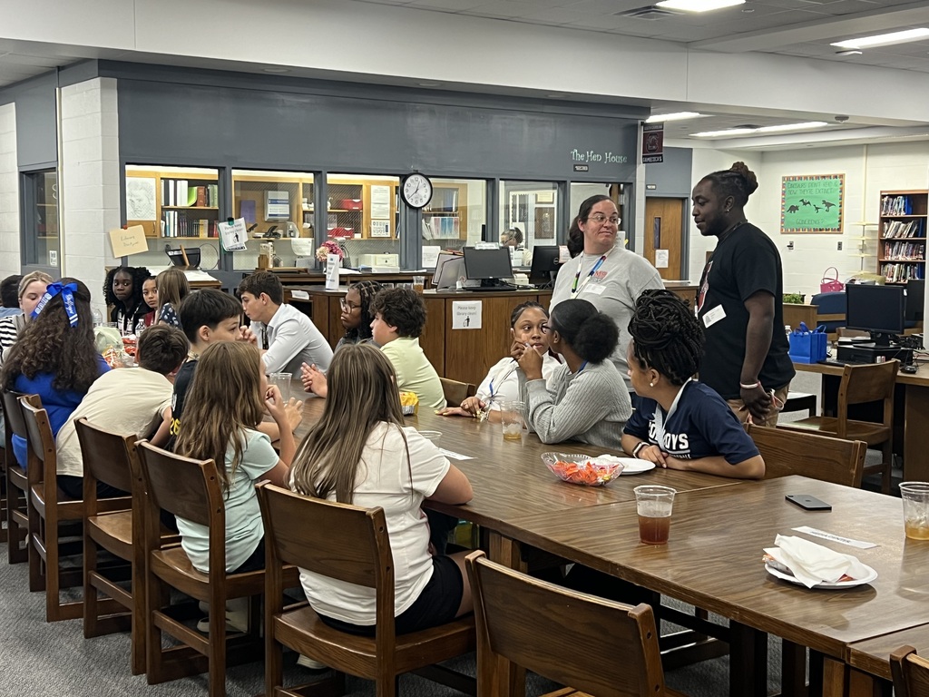 Student Government students talking at tables