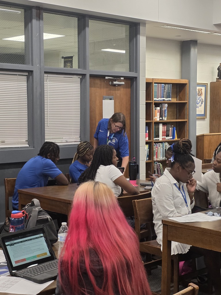 Dr. Kolmar with students working on college applications