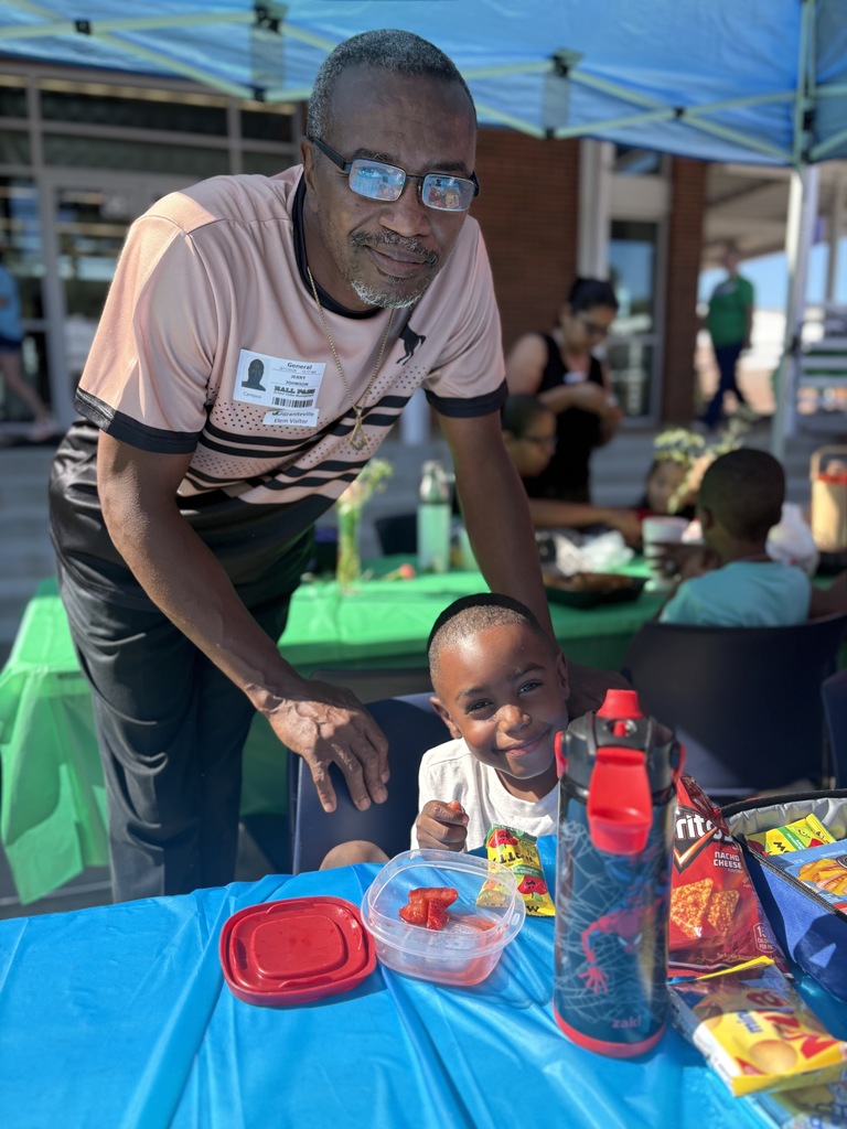 man and boy smiling at the camera