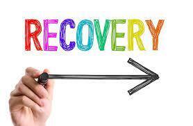 A hand holds an arrow pointing right, with the word "Recovery" above it in rainbow-colored letters.