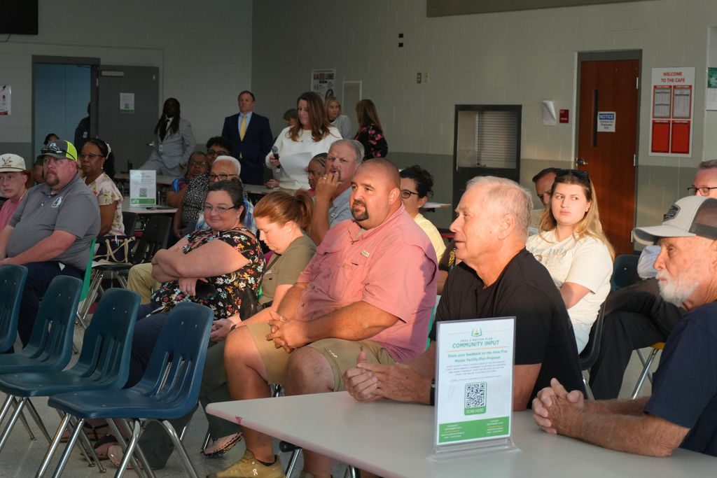 Community members listening to speaker.