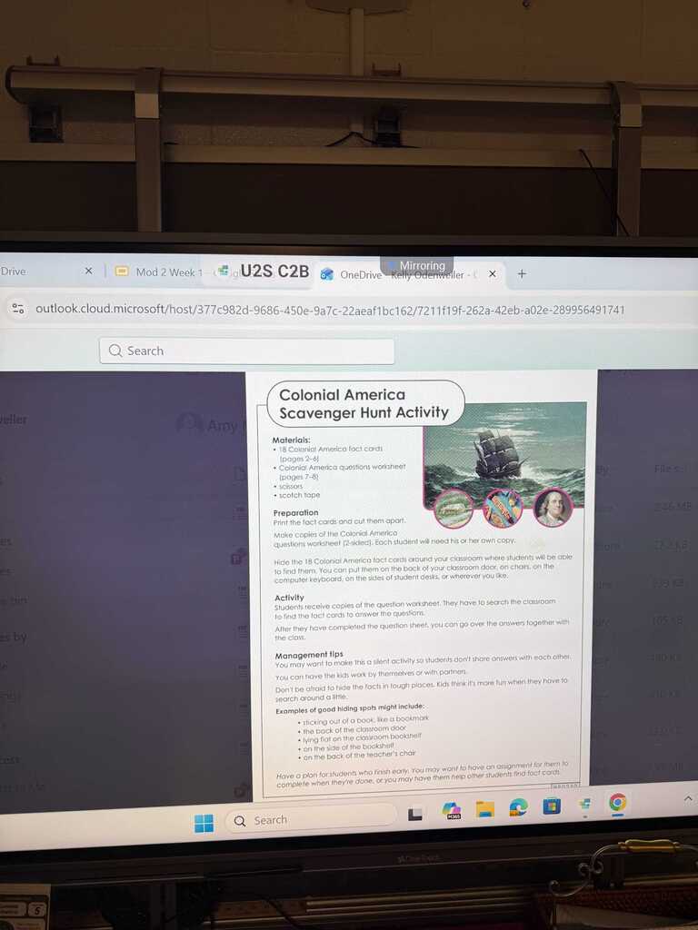 A monitor displays a webpage with "Colonial America Scavenger Hunt Activity" and images of a ship, a person, and a flag.