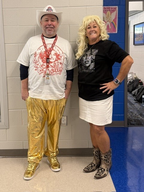 Teachers pose for Dolly dress up day