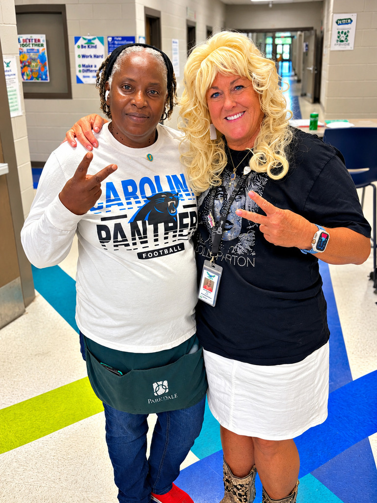 Faculty and staff pose for Dolly Dress up day