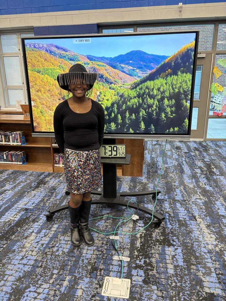 student poses for Dolly dress up day