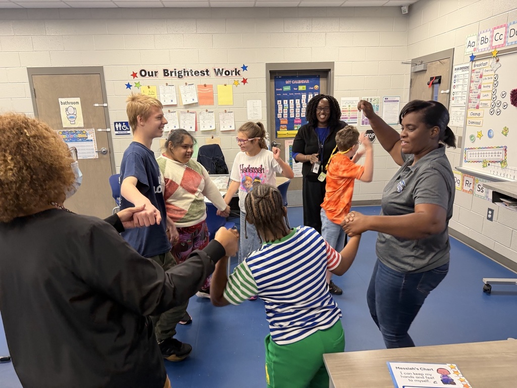 Ms. Sandy with students