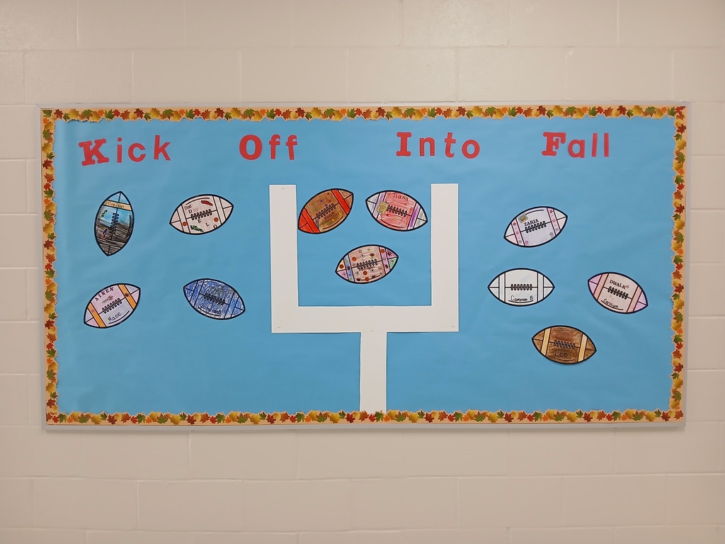 Blue bulletin board background with the words "Kick Off Into Fall" on it, and multi colored footballs scattered around. 