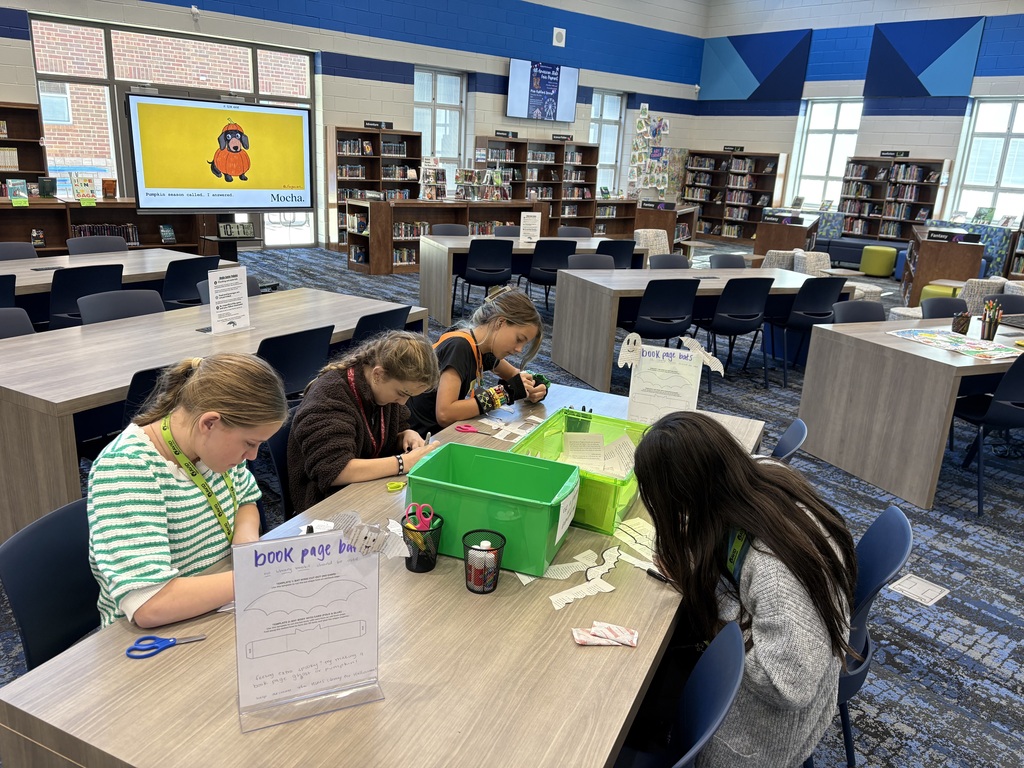 Students working on Halloween craft