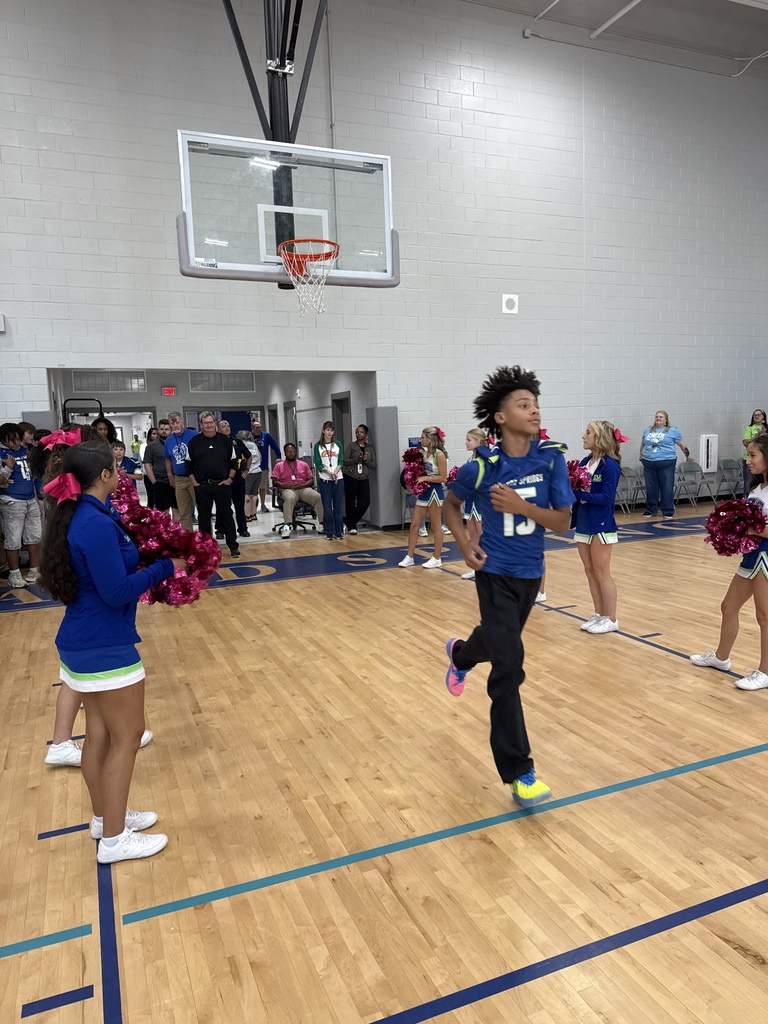 Football student at pep rally walkout