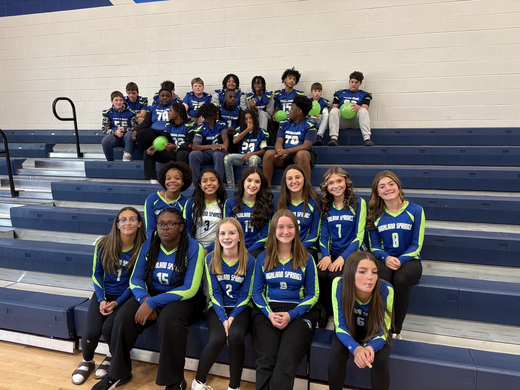 Volleyball and football team at pep rally
