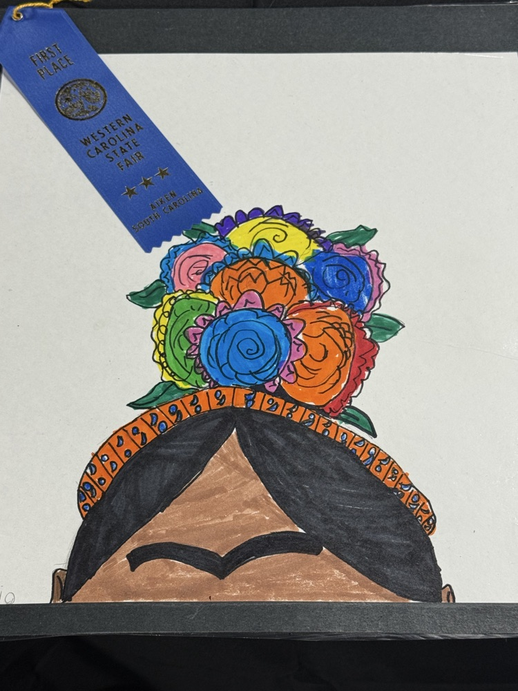 Drawing of a woman's head with a colorful flower crown and blue ribbon reading "First Place"