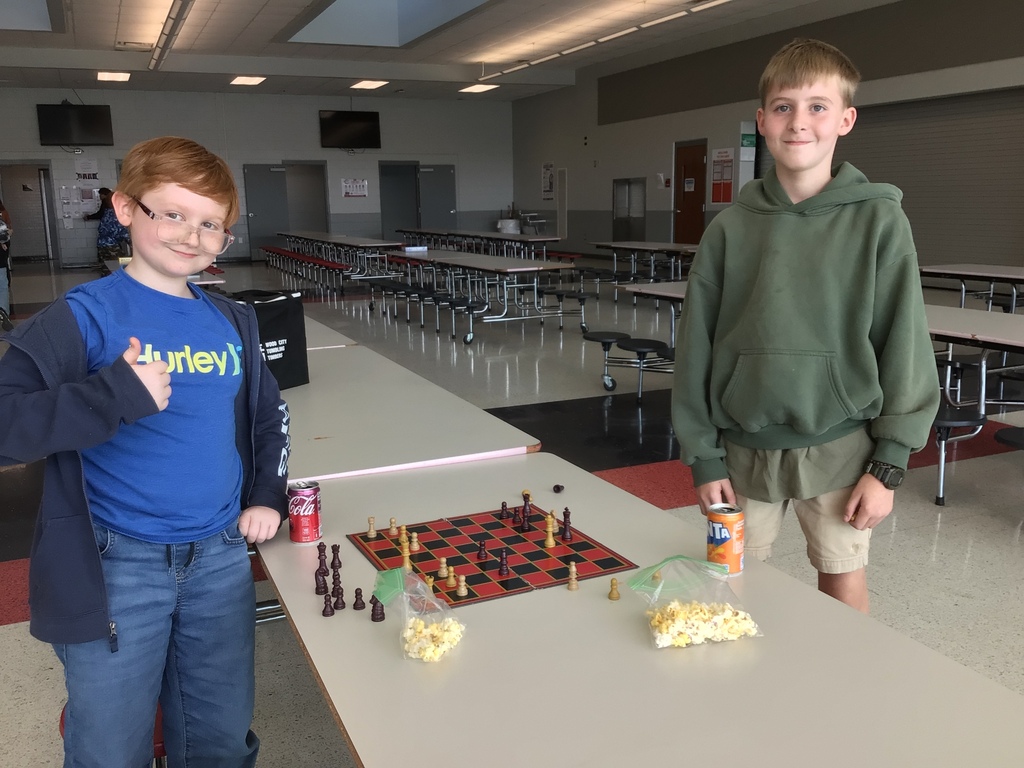 Scholars wrapping up a chess game.