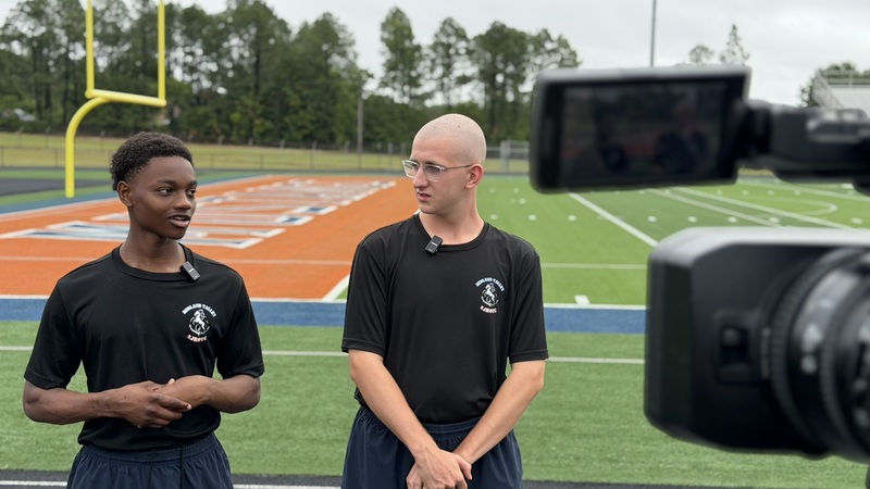Two NJROTC students being interviewed after being awake for 32 hours.