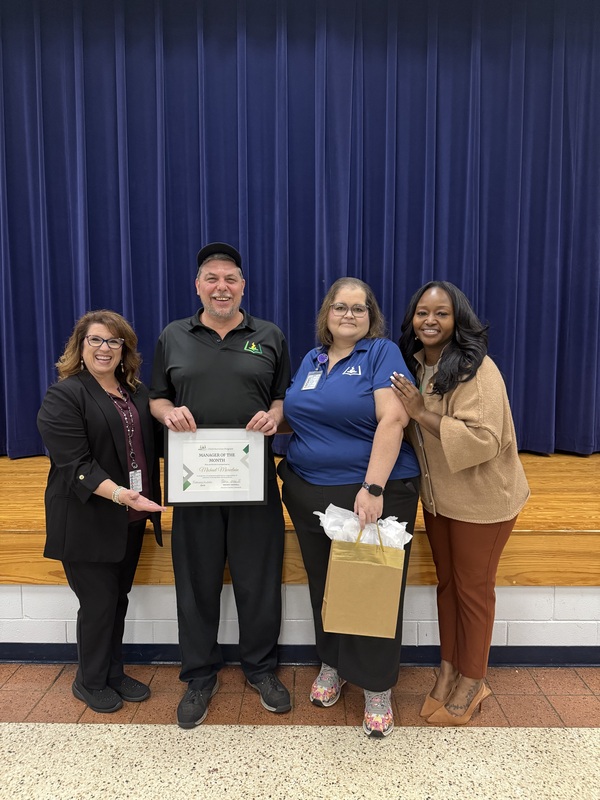 Child Nutrition Manager Michael Marcelain stands with Child Nutrition Coordinator, Child Nutrition Field Supervisor Jenny Hill and Chartwells Resident District Manager for a picture