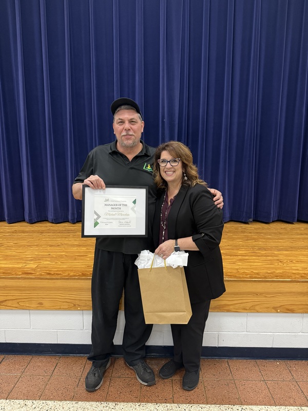 Child Nutrition Manager Michael Marcelain stands with Child Nutrition Coordinator Polly Peyinghaus for a picture