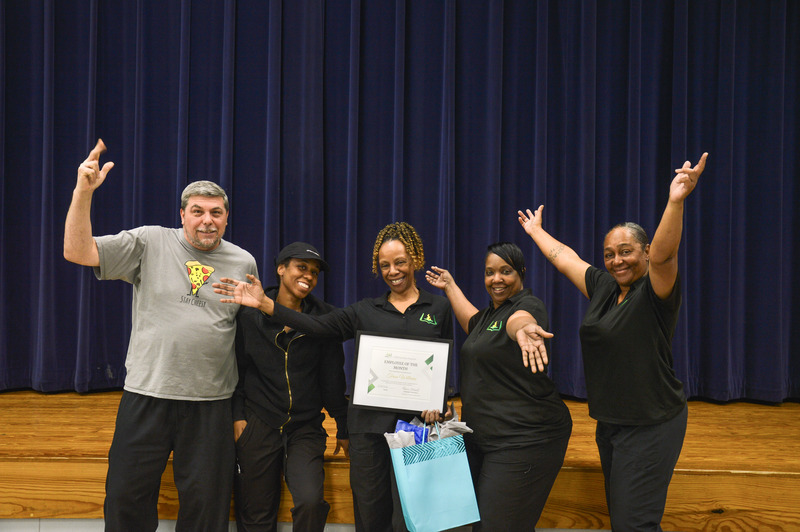 Schofield Middle Child Nutrition Operator Teresa Williams stands with Schofield's Child Nutrition team for a picture