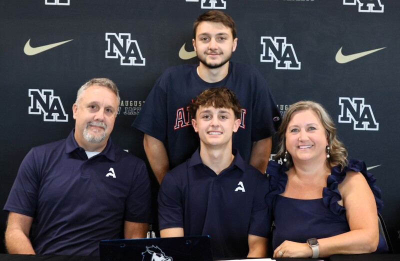 Player with family at signing. 