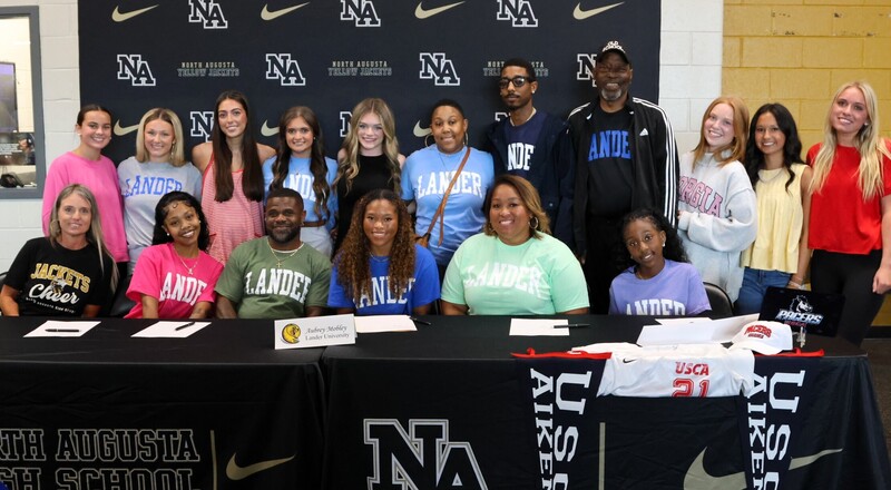 Player with family at signing. 