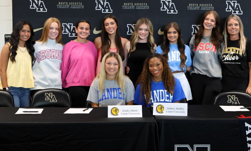 Player with family at signing. 