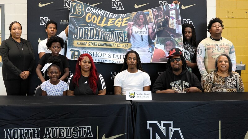 Player with family at signing. 