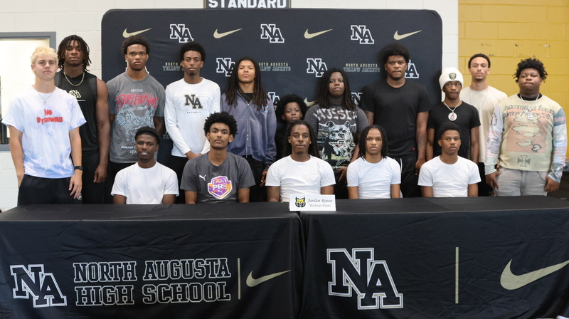 Player with family at signing. 