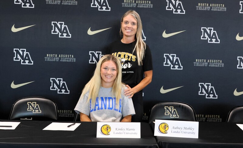Player with family at signing. 