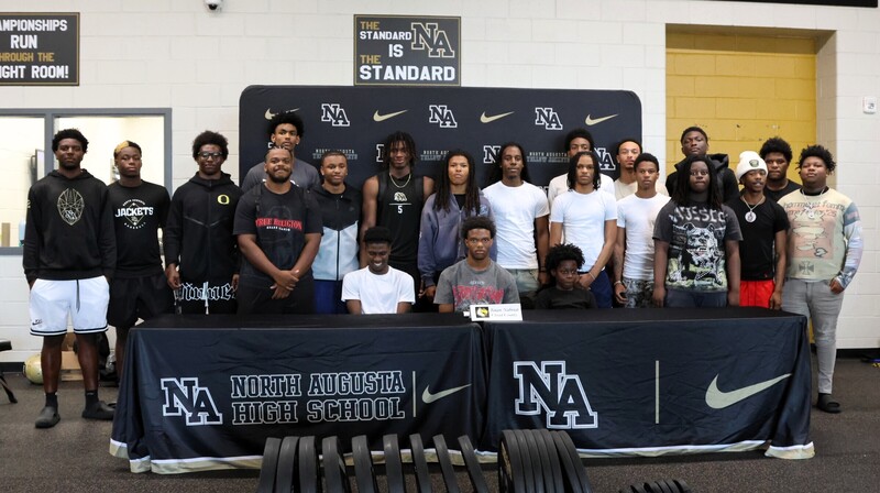 Player with family at signing. 