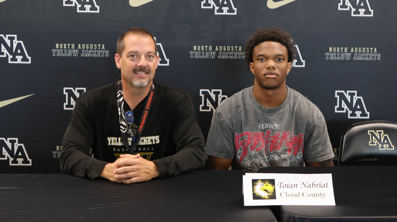 Player with family at signing. 