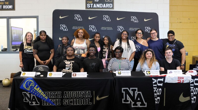 Player with family at signing. 