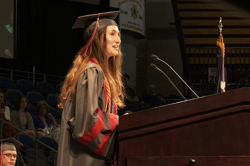 Salutatorian Amanda Marie Counts talking at the podium during graduation.