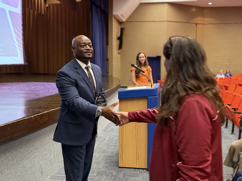 A South Aiken AP accepts and award.