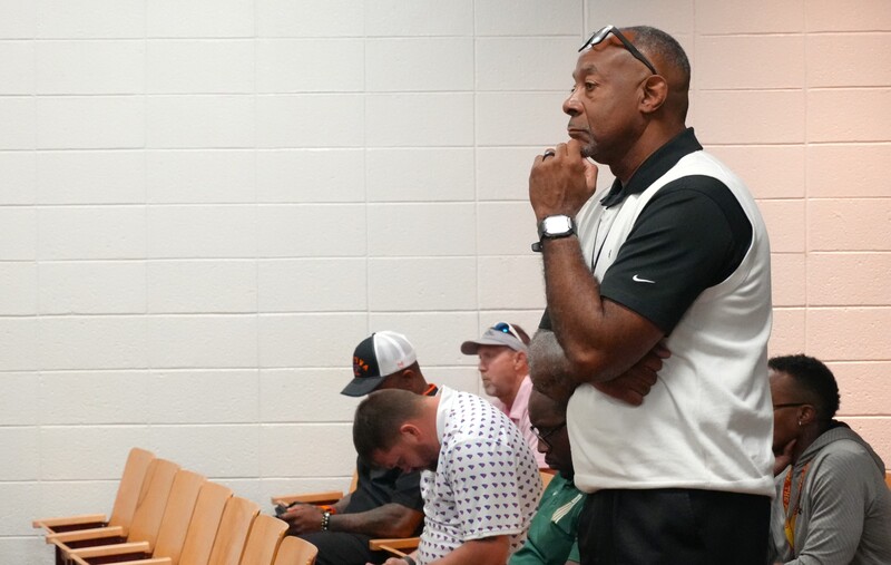 Larry Dunn listens to the coaches convocation.