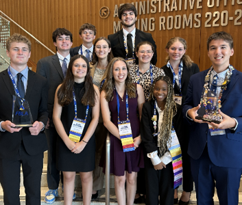 "FBLA Team Dressed in Blue Professional Attire"