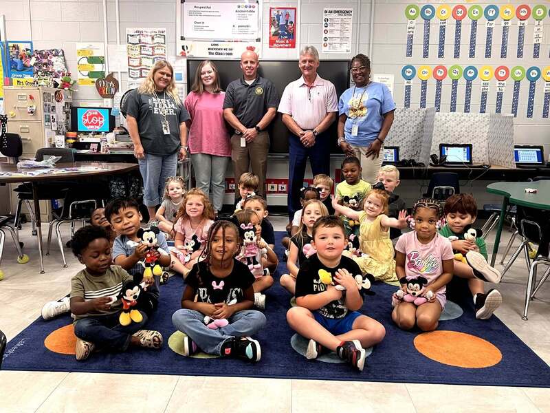 Students from JD Levar posing with their stuffed animals.