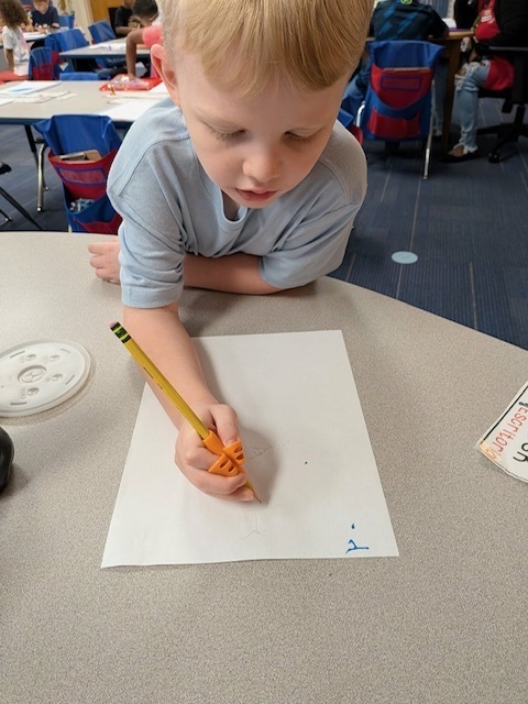 A student is practing writing.