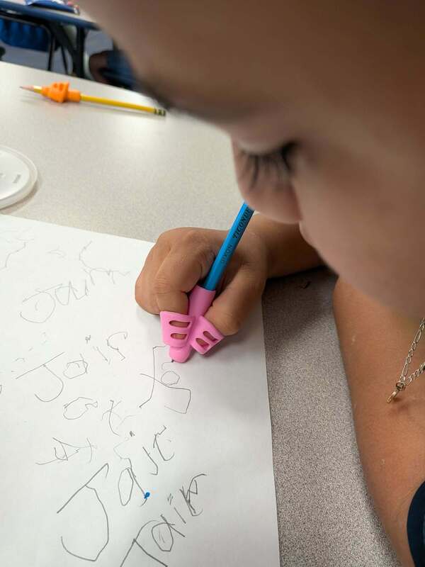 A student is practing writing.