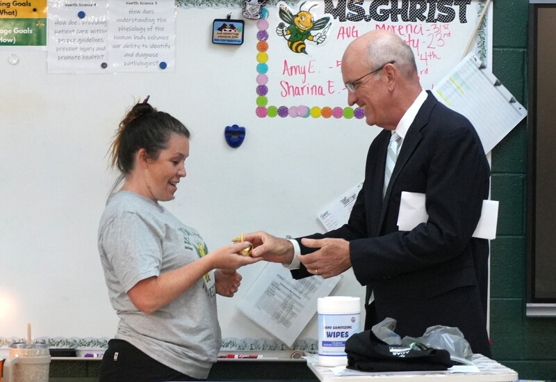 Kristy Ghrist receives her Golden Apple award.