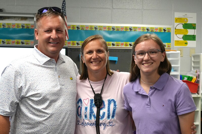 Kari Keck smiles with her family.