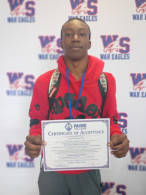 Ramade Brown holding his acceptance certificate