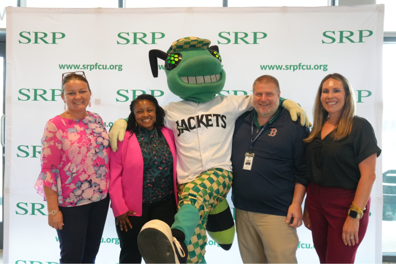 ACPSD Leadership poses with Augusta GreenJackets mascot.