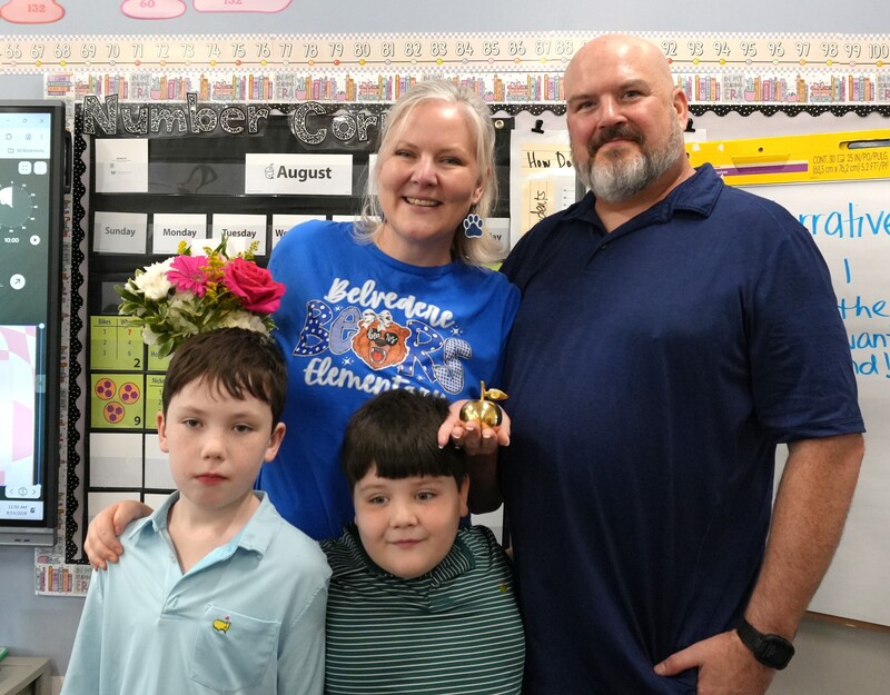 Cassie Remson smiles with her family and children.